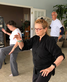 Photo: An in-person Tai Chi class. © All rights reserved.